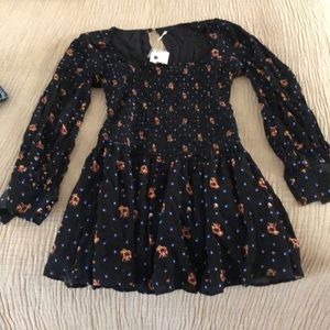 Free people black floral dress. Never worn, tags still on.